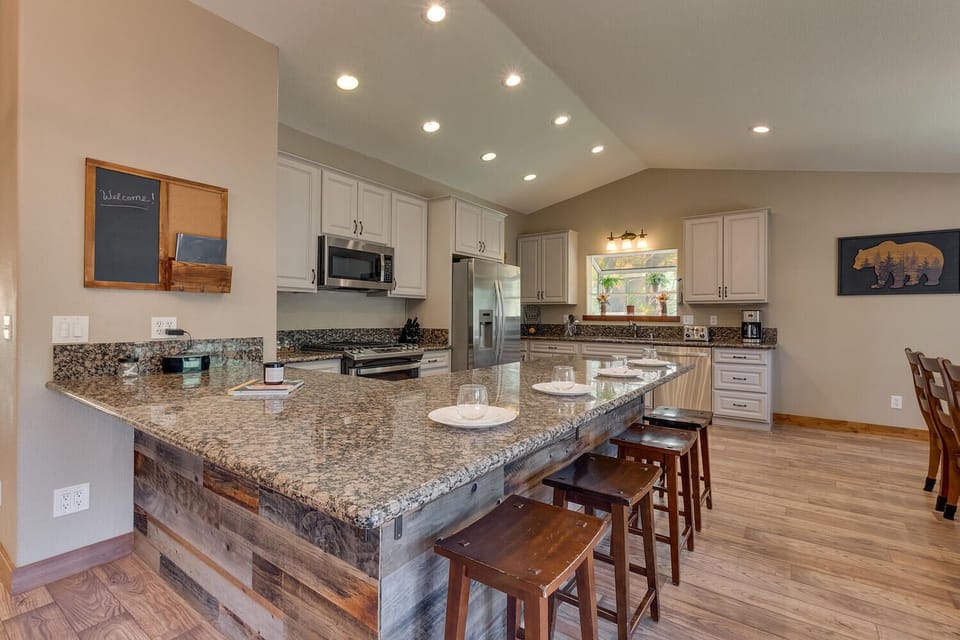 - Spacious kitchen with granite counters and bar seating  
- Stainless steel appliances for cooking convenience  
- Perfect for family meals in your Tahoe vacation home