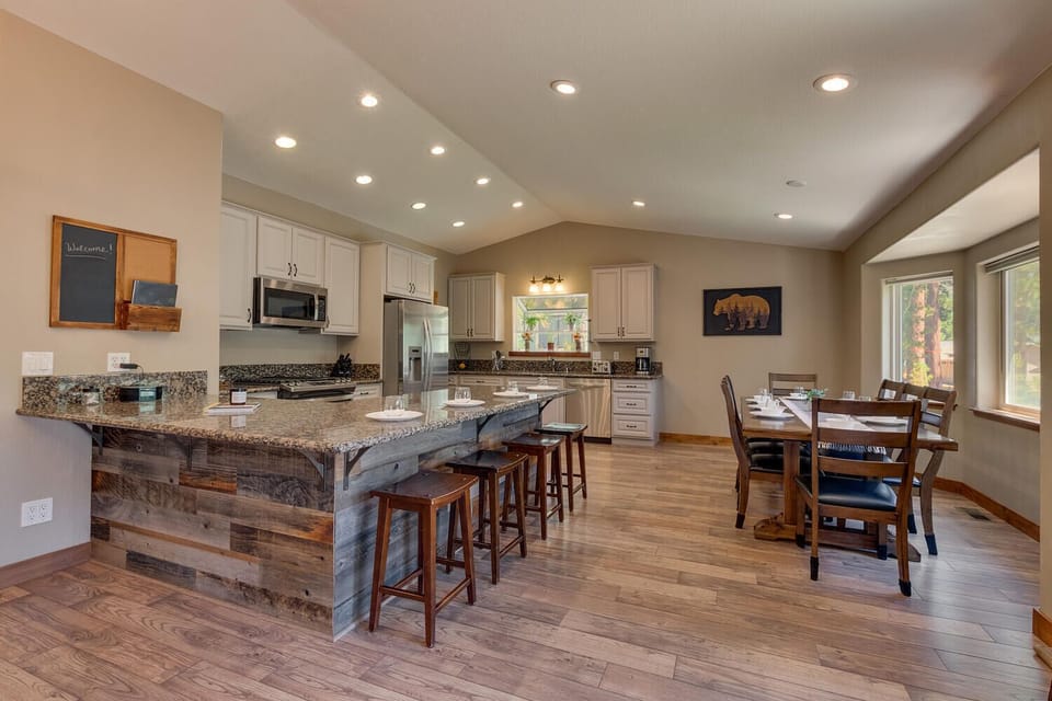 - Open kitchen with granite counters and bar seating  
- Fully stocked with stainless steel modern appliances  
- Large dining area for family meals and gatherings