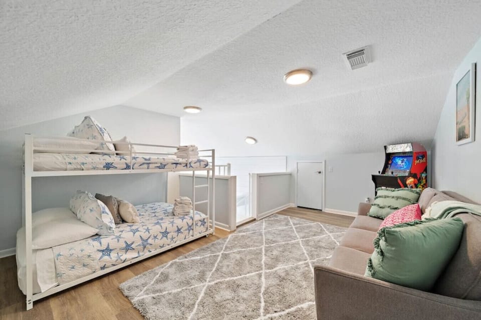 This bedroom has a twin bunk bed