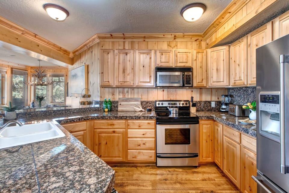 Fully Equipped Kitchen with All the Utensils Needed and Stainless Steel Appliances