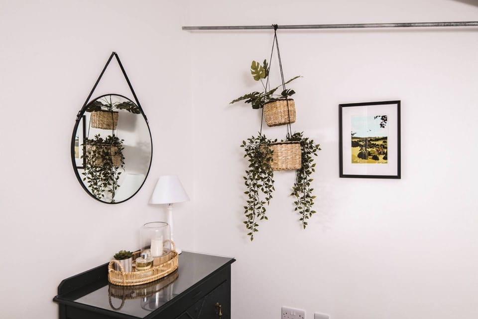 Hanging baskets on the wall at Luxury Penthouse, Cotswolds