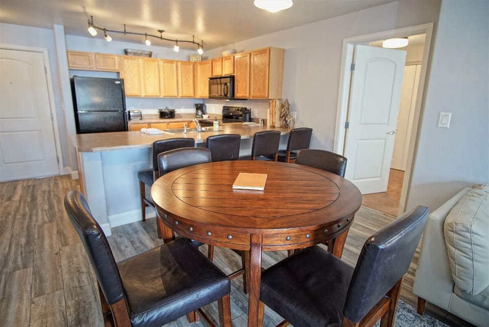 Dining or Game table for 4 - Round Wood Table with Studded Rim & Matching Stools with Black Leather Upholstery