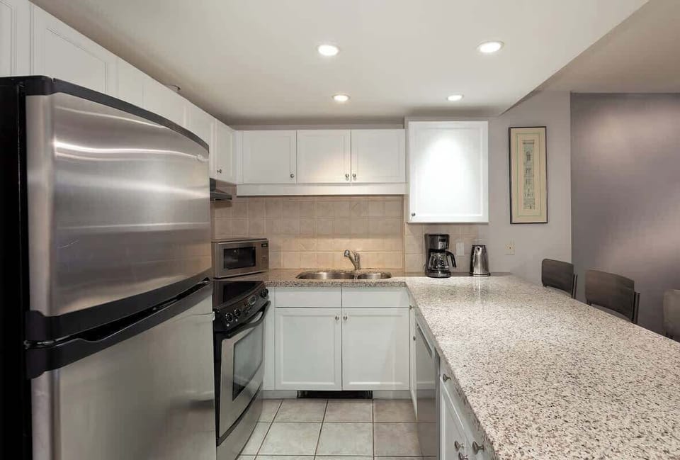 - Modern Whistler kitchen with full amenities included  
- Perfect for self-catering family or romantic getaways  
- Stainless steel design with cozy mountain ambiance  
