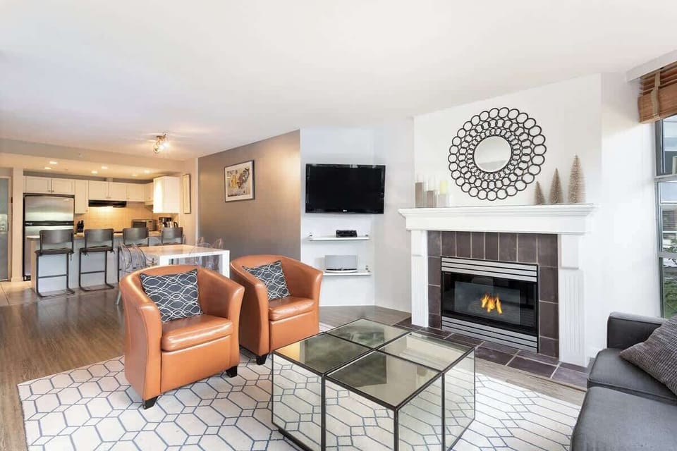 - Stylish Whistler condo with fireplace and open layout  
- Bright living room perfect for family gatherings  
- Elegant design blending comfort and mountain vibes  
