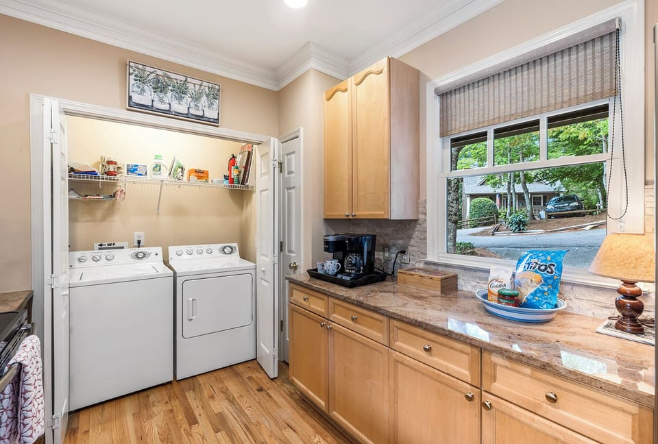 Laundry conveniently located in kitchen.