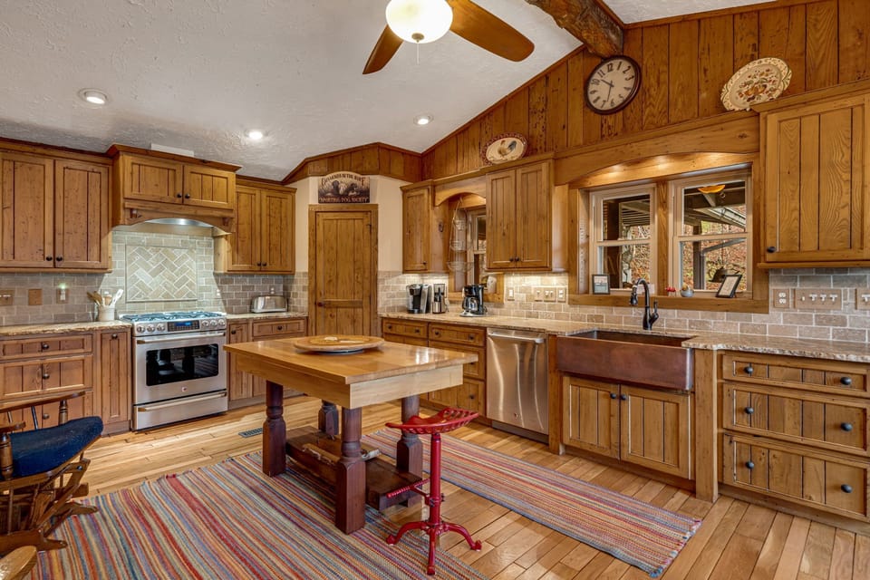 Kitchen with chestnut cabinets and granite countertops