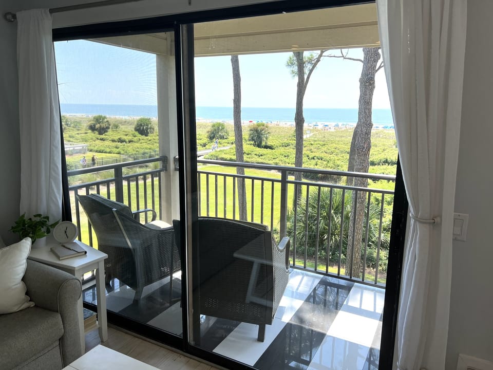 Best view! Sit on the patio and enjoy the beach and sounds of the waves.