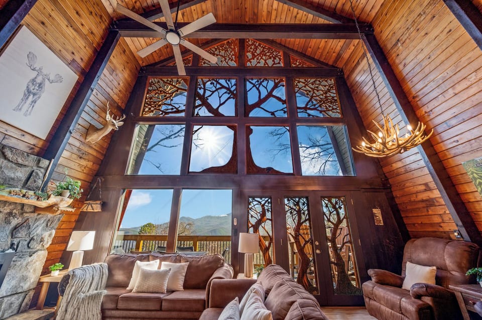 Stunning views, 2 story wood carving, gas fireplace & perfect space for relaxing