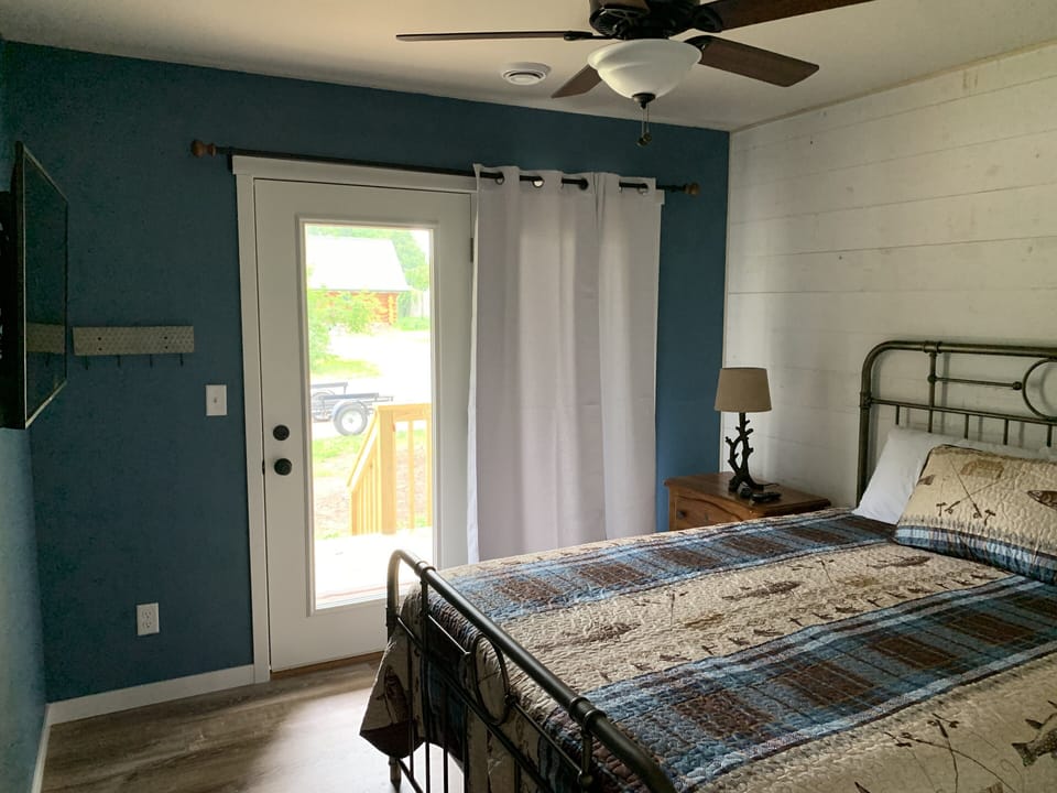Master bedroom suite with deck and lake view.