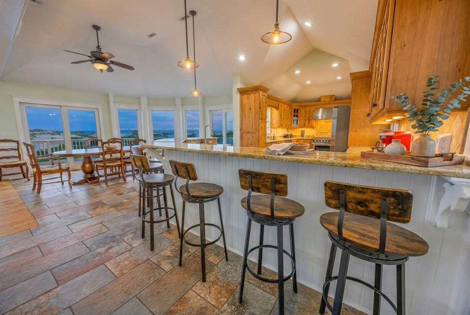 Gourmet kitchen with premium cabinetry — fully equipped for preparing elegant meals from casual breakfasts to formal dinners