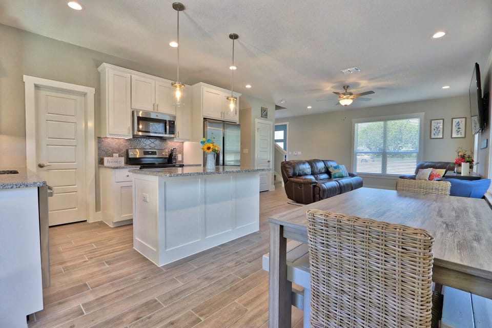 Full kitchen with refrigerator, stove, oven, microwave, and coffee maker