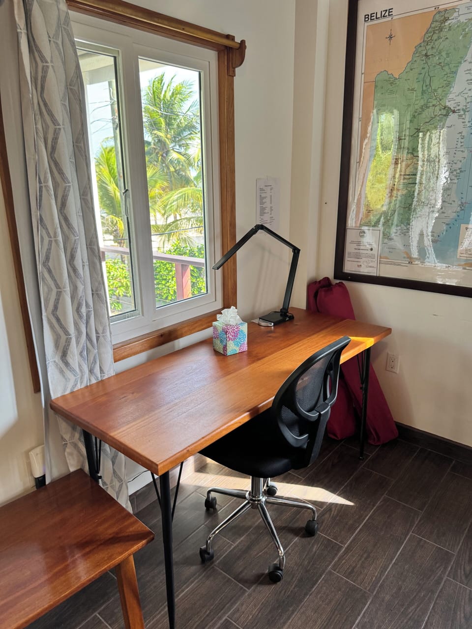 A 5-ft desk with an office chair and desk light.
