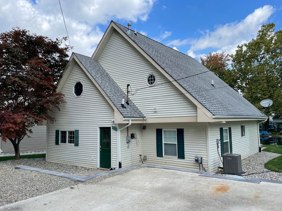 Street-side view of house, parking area