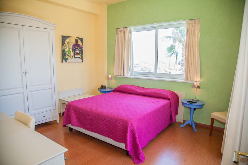 Standard Triple Room | Minibar, in-room safe, desk, blackout drapes