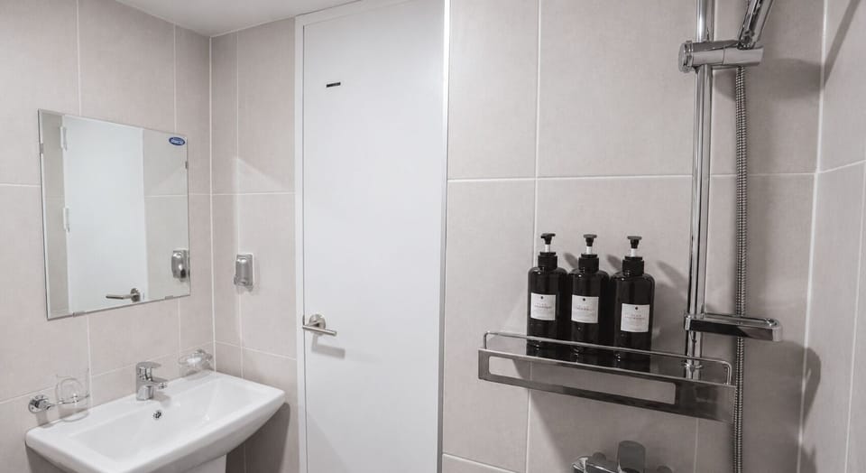 Standard Double Room | Bathroom | Shower, free toiletries, hair dryer, slippers