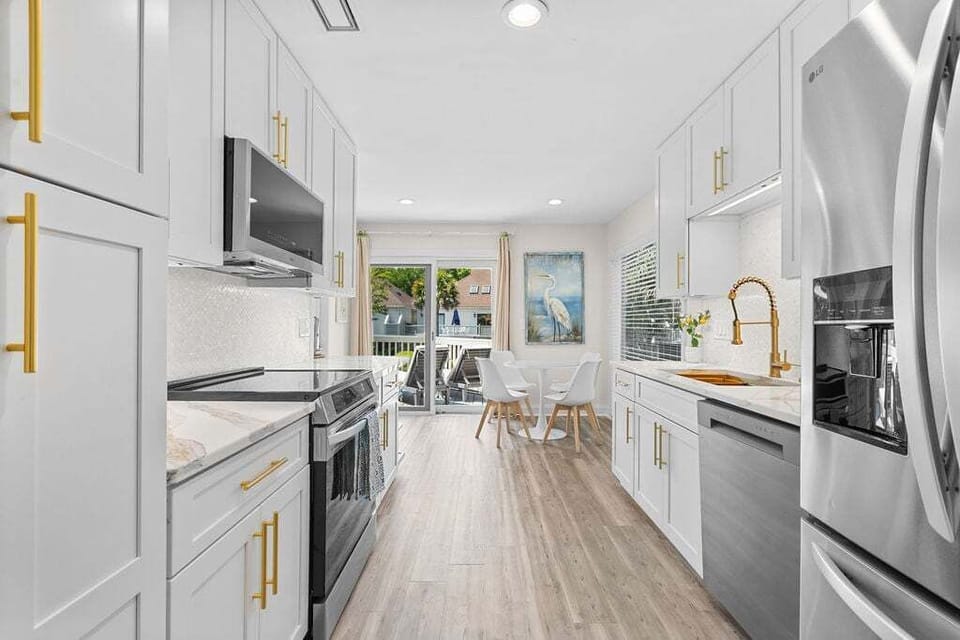 Renovated galley kitchen with stainless steel applicances
