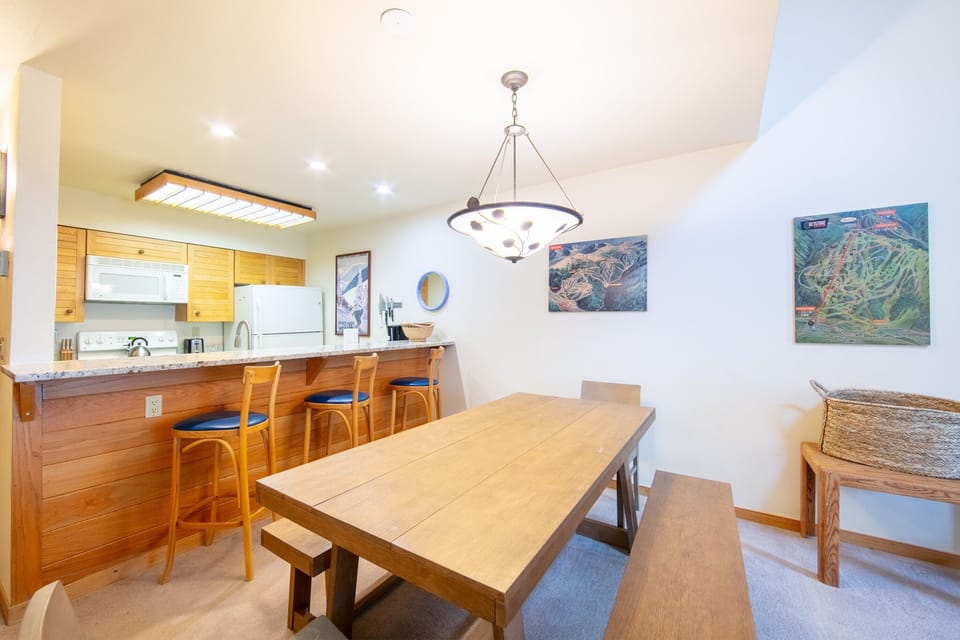 Your spacious kitchen and dining area features warm wood tones, modern appliances, and seating for memorable meals together.