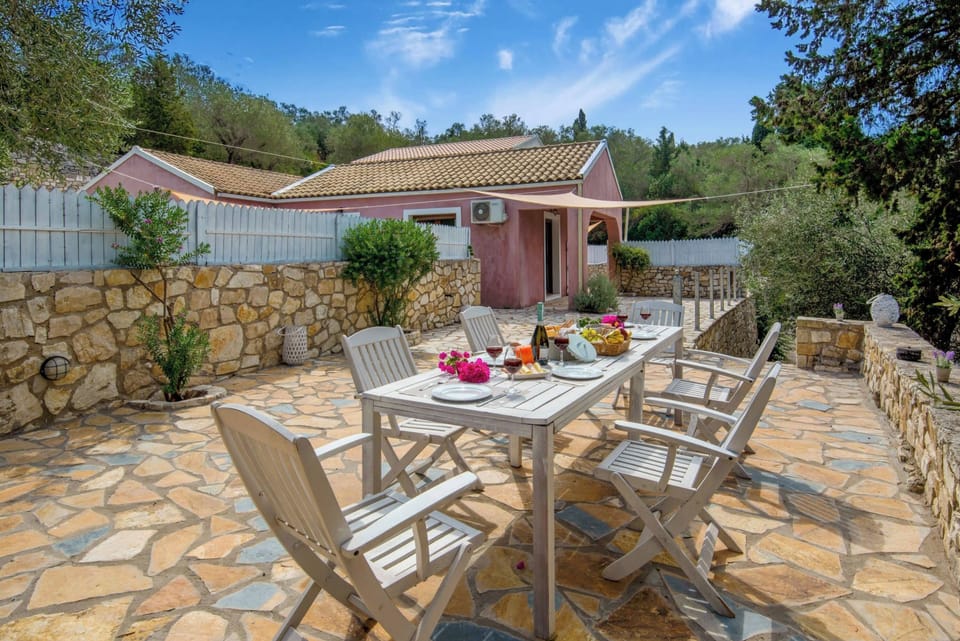 Beautifully Arranged Terrace with Outdoor Dining Area
Relax or dine al fresco on the stone terrace, framed by Mediterranean plants and peaceful surroundings.