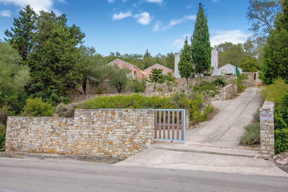 Exterior View of the Property Surrounded by Nature
A peaceful setting with the home nestled in lush greenery, offering privacy and authentic island charm.