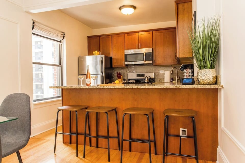 Big Kitchen with a 6-chair table and 4 additional stools. Echo show is in the kitchen for your viewing and music tastes!