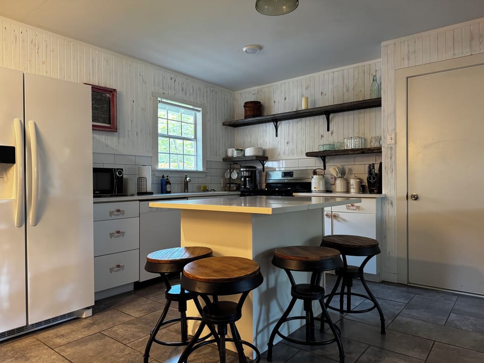 kitchen with drip coffee maker, gas stove, and fridge w/ ice & water dispenser