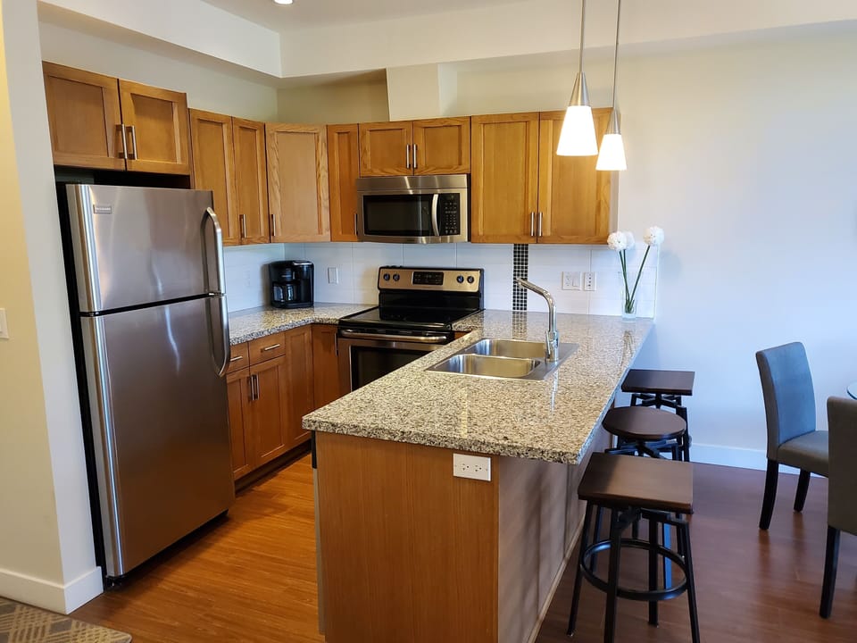 Kitchen - fully stocked with new dishes, cookware, and utensils.