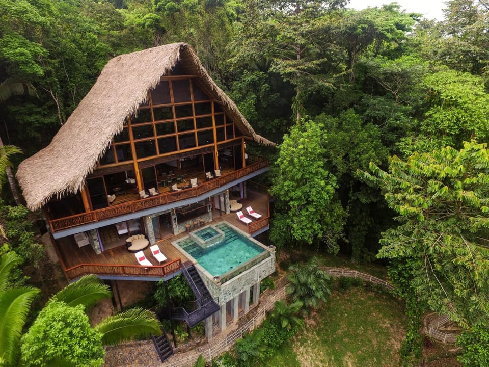 Rear wide shot w/ stream.