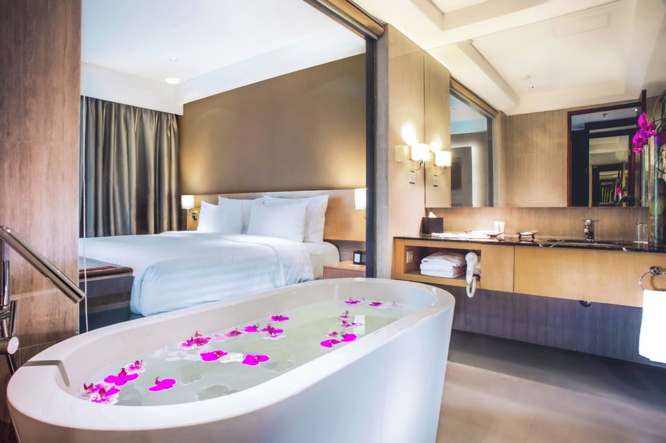 Club Room, 1 King Bed (Ambassador) | Bathroom | Shower, slippers, towels, toilet paper