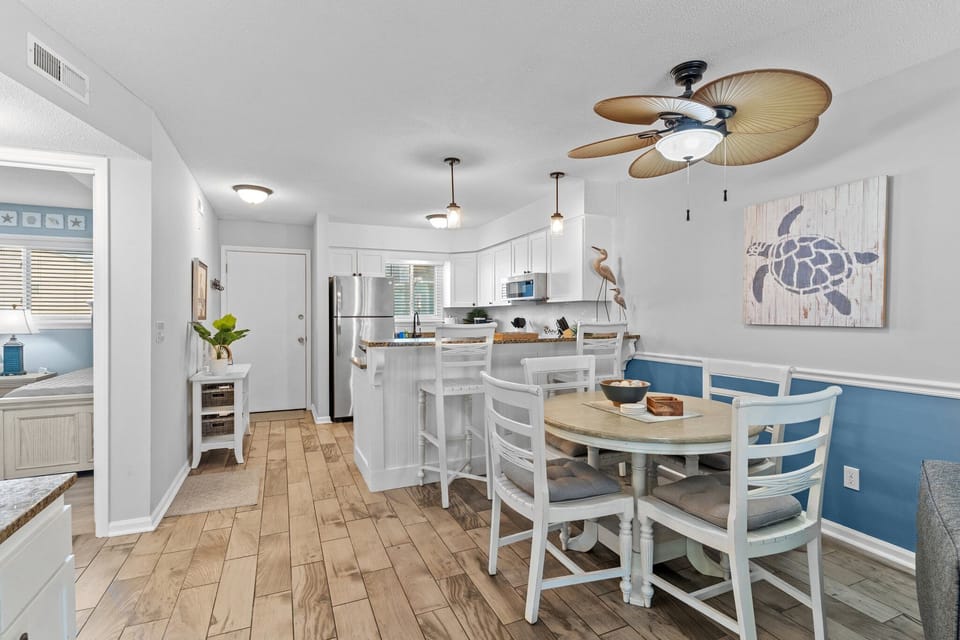 Step into your coastal-inspired kitchen where beach vibes meet modern comfort. Enjoy cooking meals together in this bright, airy space.