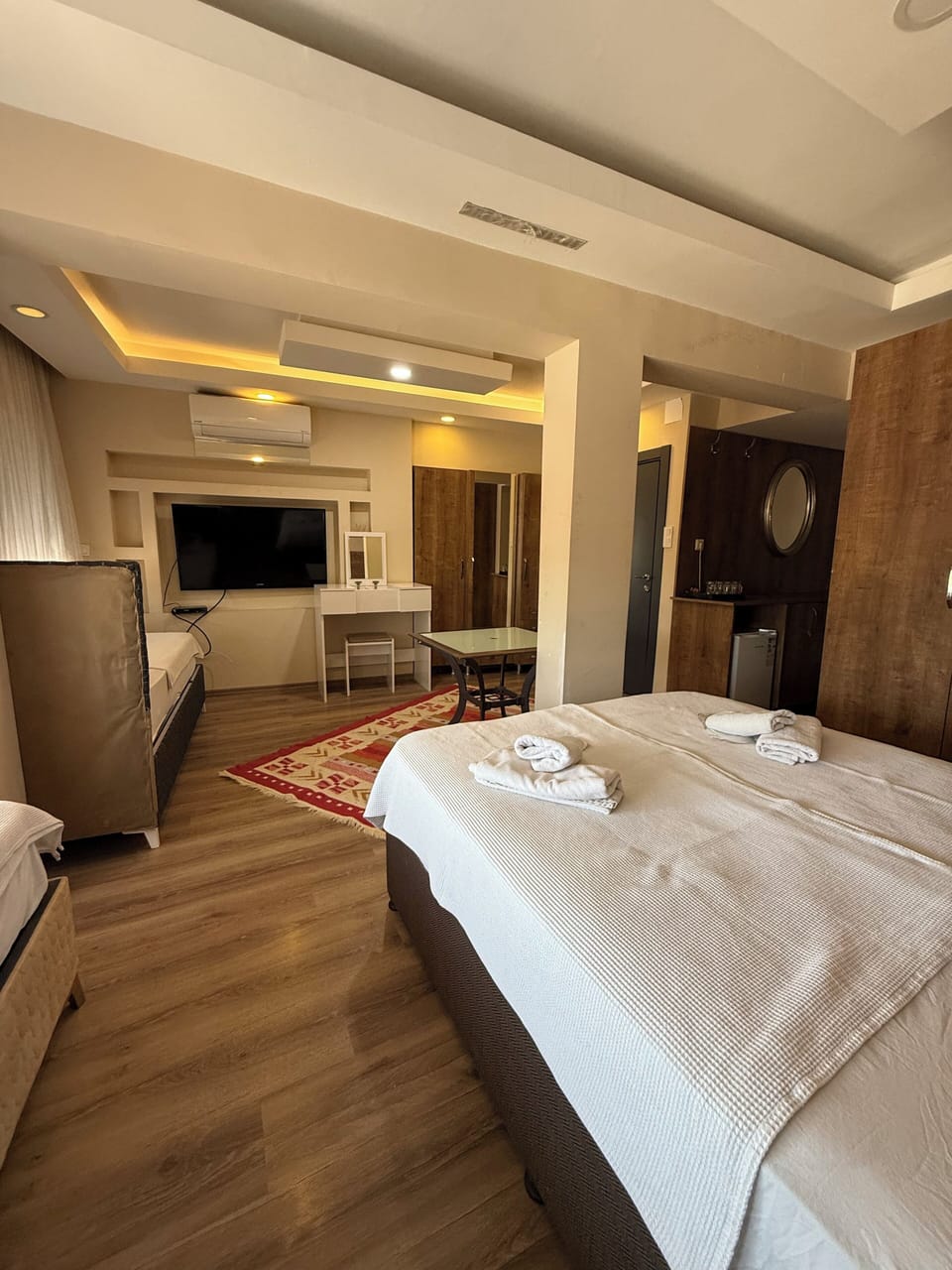Luxury Quadruple Room, Multiple Beds, Refrigerator, City View | Soundproofing, iron/ironing board, free WiFi, bed sheets
