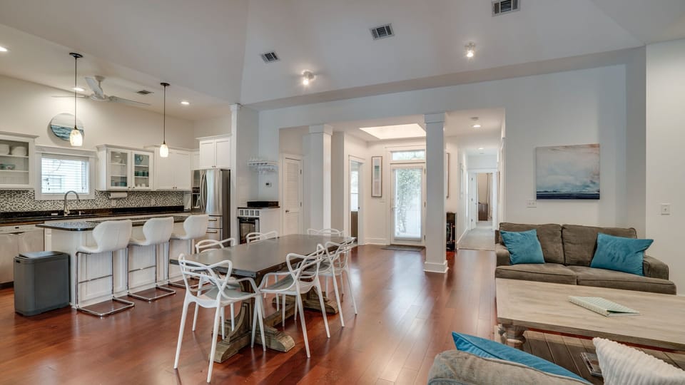 High end appliances, wine fridge & gracious island just steps to courtyard out front and veranda and pool out back.