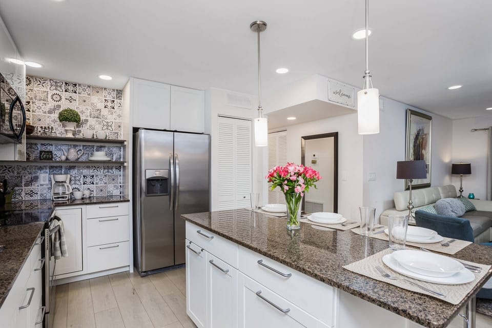 Stainless appliances and plenty of cabinets for storage.  Kitchen is stocked with dishes, glasses, pots and pans (no food items)