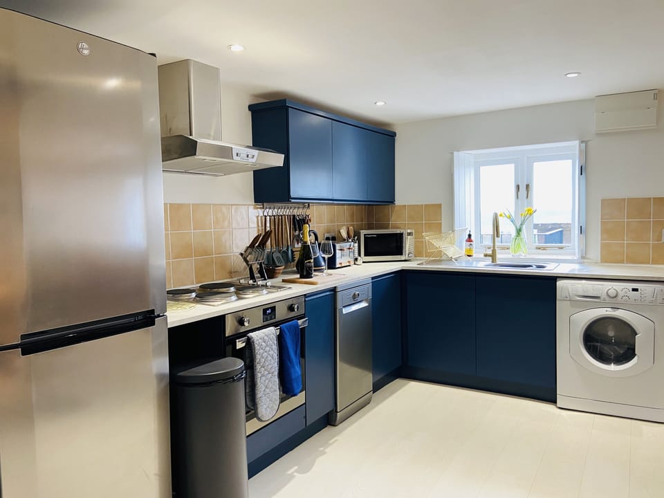 The newly refurbished, fully equipped kitchen with beautiful views. 