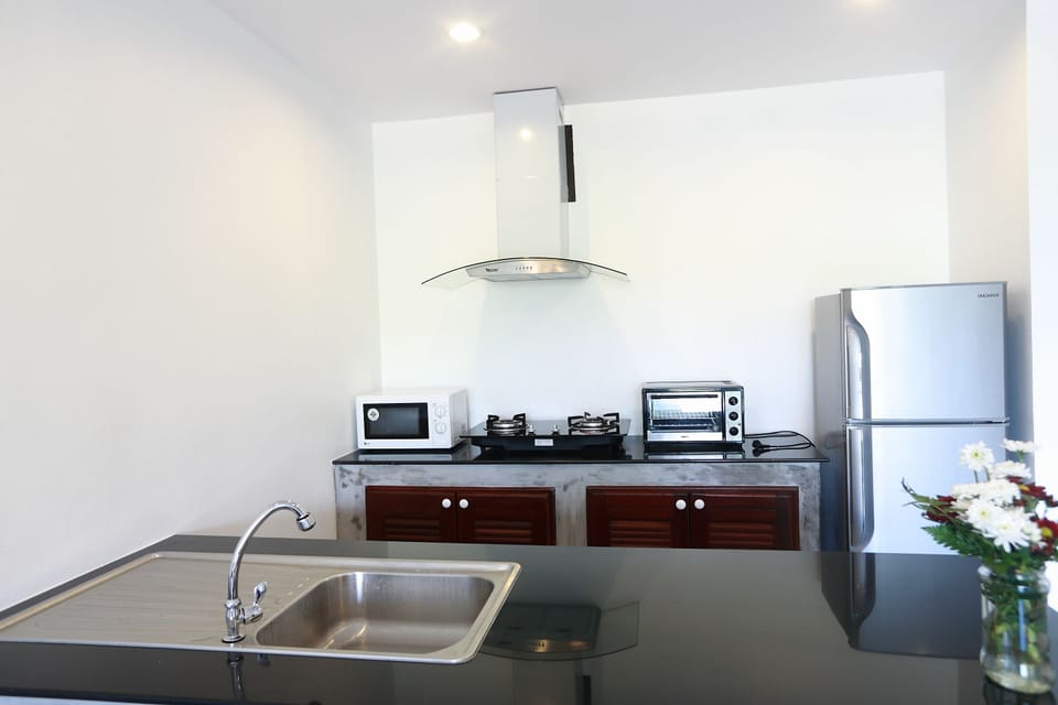 Luxury Triple Room, 2 Bedrooms | Private kitchen | Mini-fridge