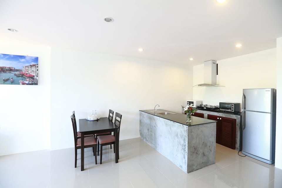 Luxury Triple Room, 2 Bedrooms | Private kitchen | Mini-fridge