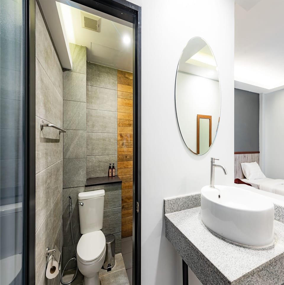 Shower, hair dryer, slippers, towels