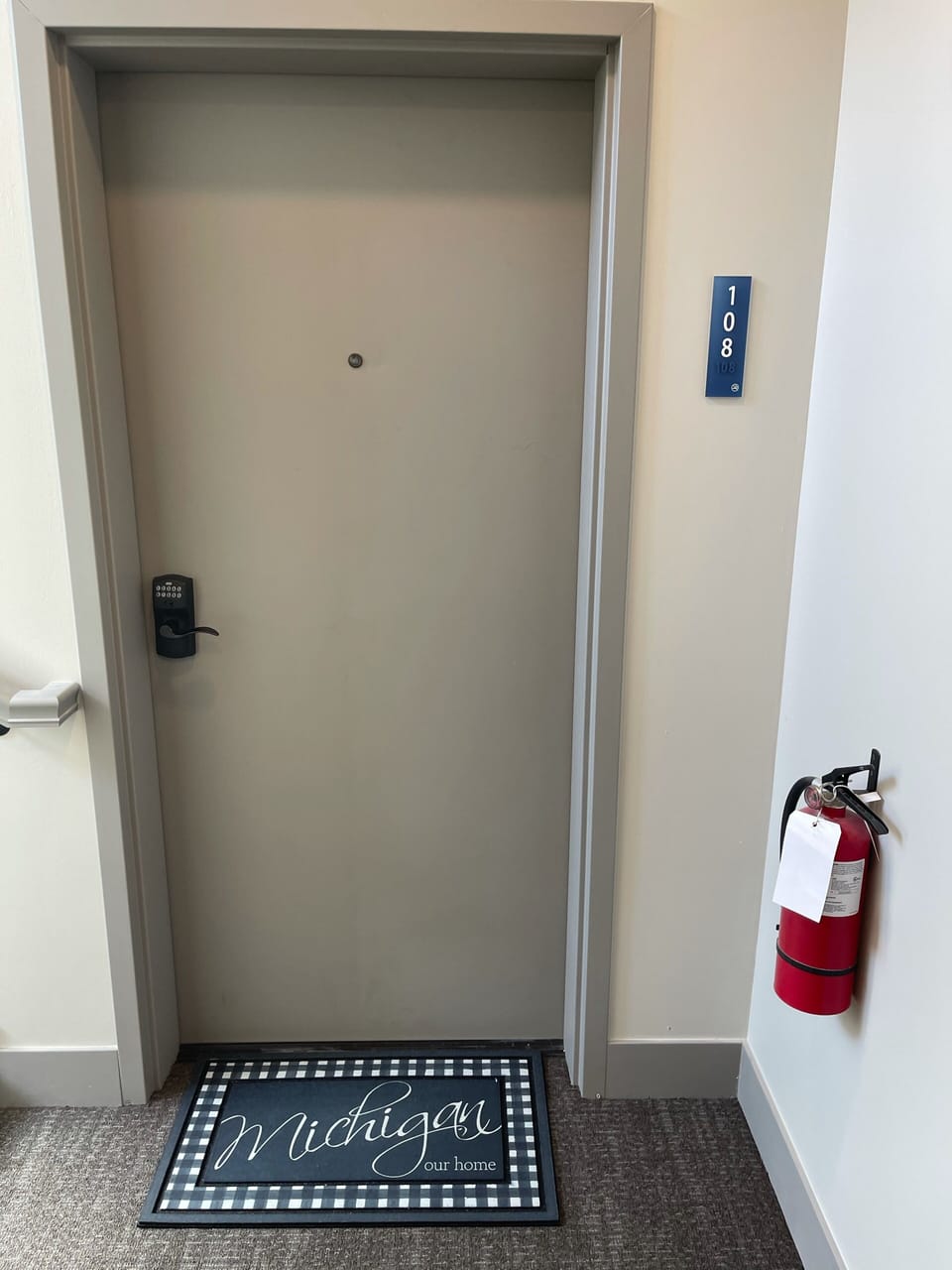 Entrance to condo. Safety features such as sprinklers and fire extinguishers