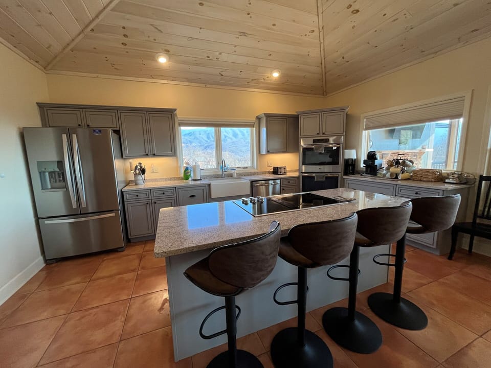 Large kitchen w/ 4 seat island, high end appliances and double oven.  Cook it up