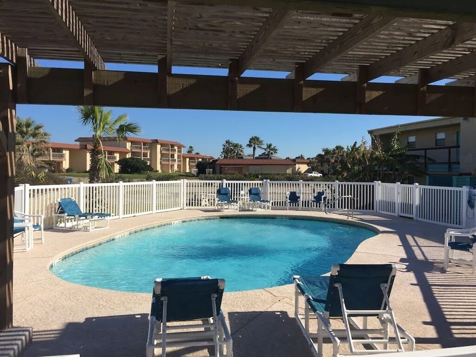 Covered deck in case you want to enjoy the pool out of the sun.