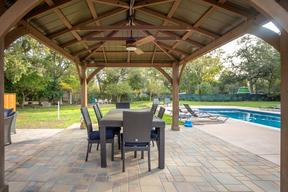 Covered al fresco dining area near the pool.