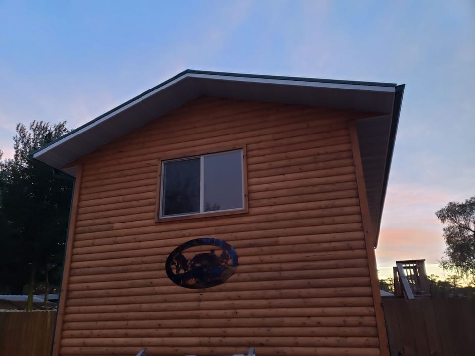 This 1 bedroom is downstairs. On the left, as you pull in the driveway. 
