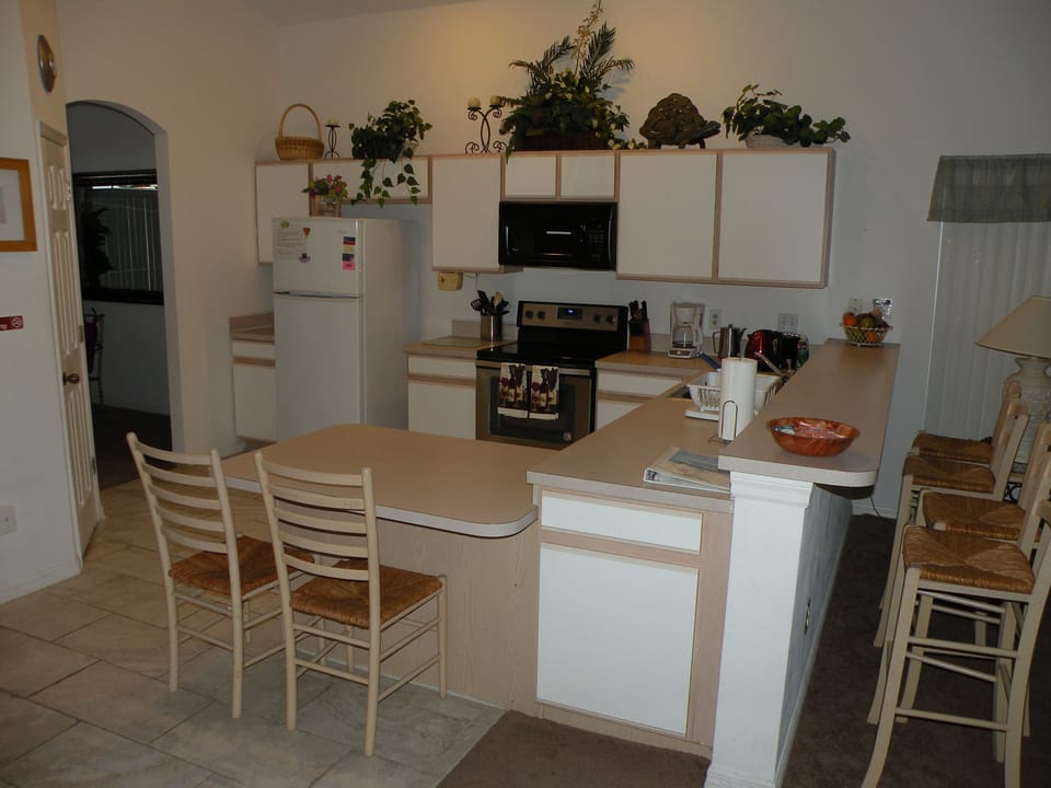 Villa | Private kitchen | Fridge, microwave, oven, stovetop