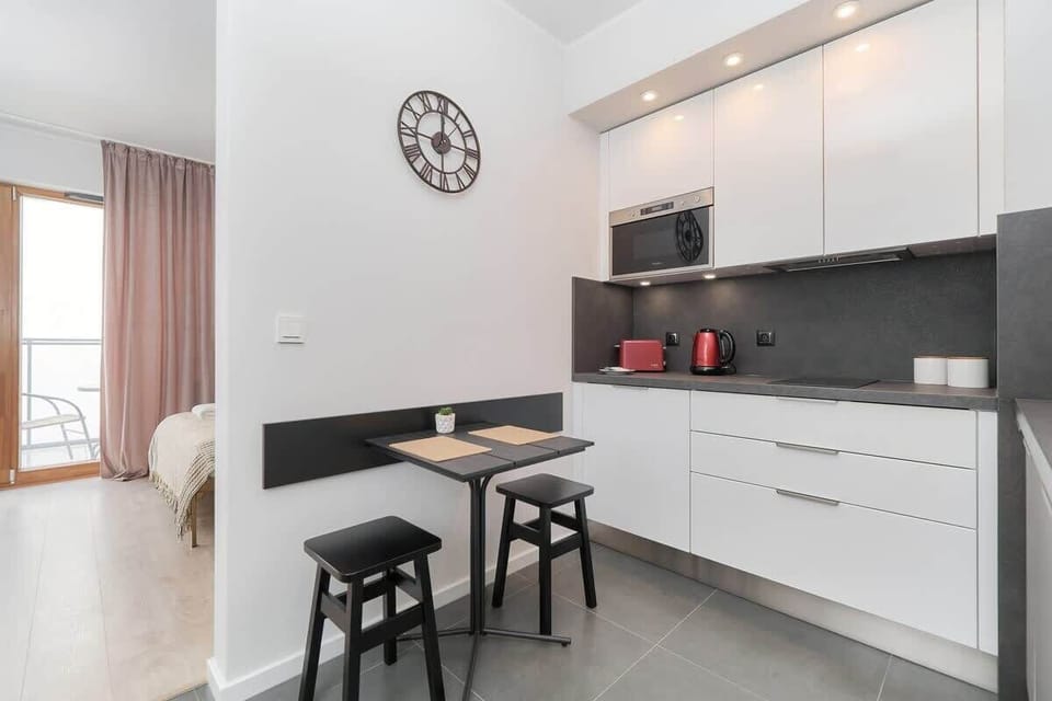 Cook and dine in style with the modern kitchen and dining area.