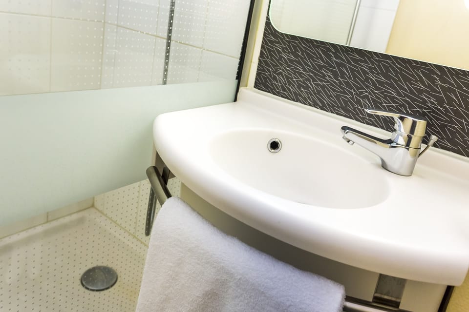 Shower, eco-friendly toiletries, hair dryer, towels