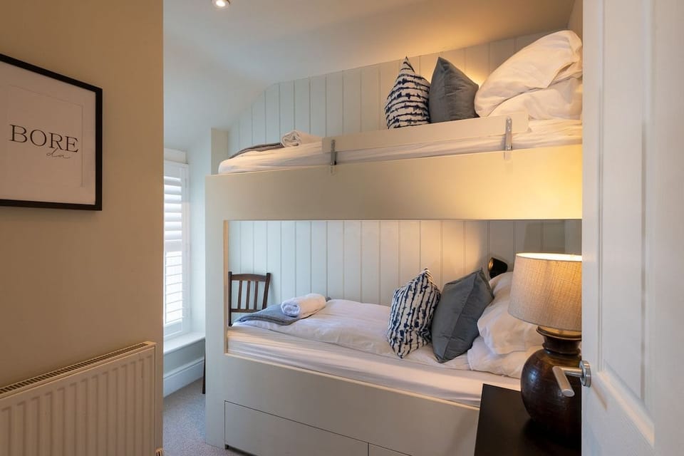 Bunk room with built-in bunk beds, ideal for children at four-bedroom pet-friendly apartment above The White Eagle, Rhoscolyn, Anglesey