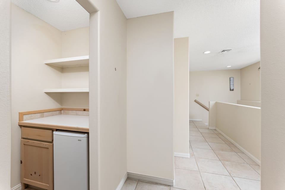 Refrigerator and counter/shelf spaces in the hall way of the 2nd floor. 