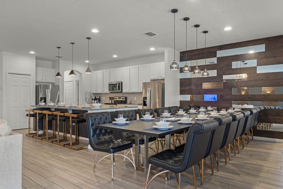 - Large dining area with seating for big groups and families  
- Vacation rental with modern kitchen and stylish interiors  
- Orlando group rental designed for comfort and convenience