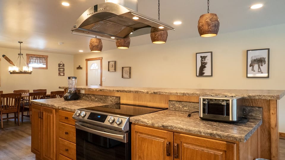 Kitchen - Main Level. Stocked kitchen with gas range and exhaust.