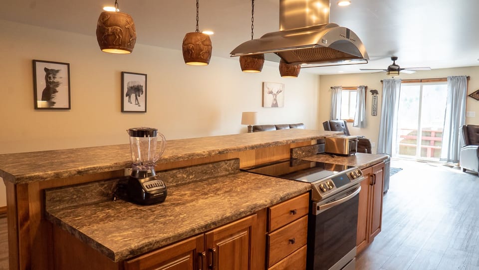Kitchen - Main Level. Stocked kitchen with gas range and exhaust.