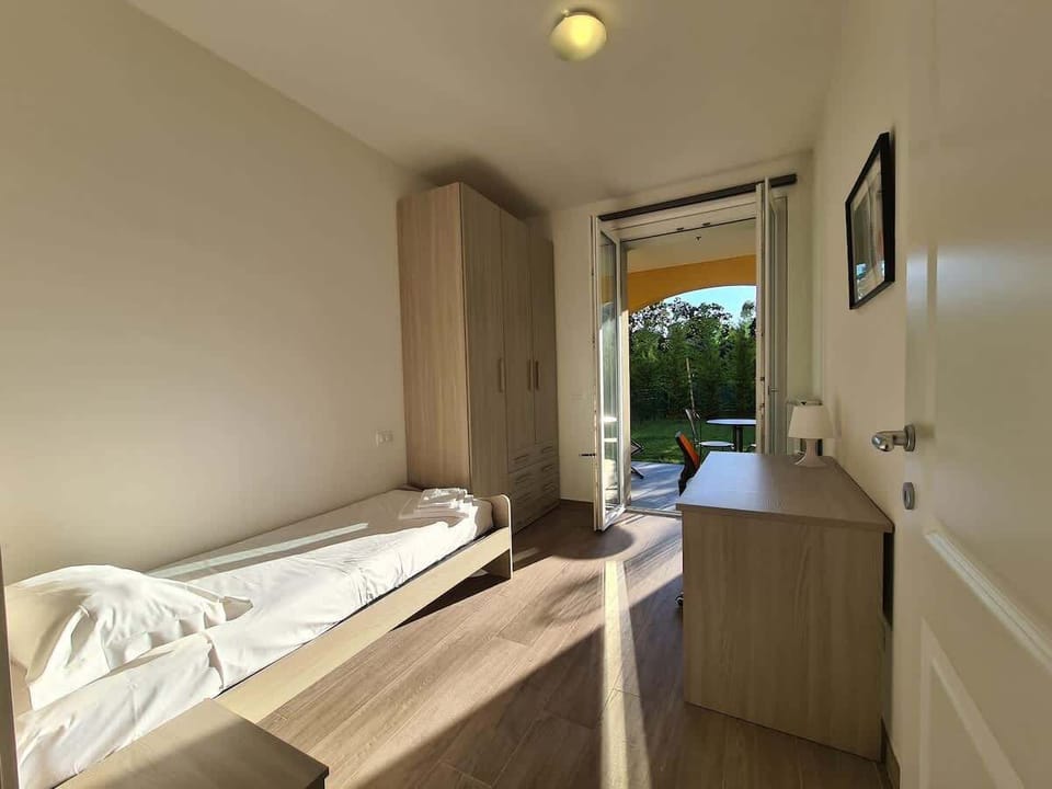 Camera da letto singola con accesso al giardino privato